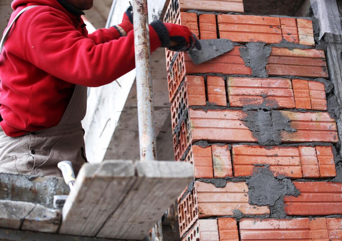 man working on a chimney