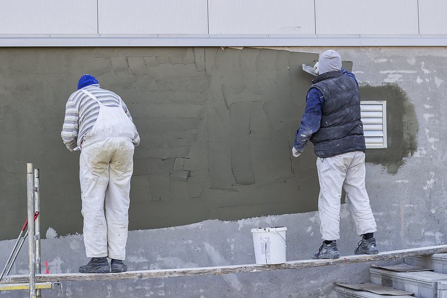 men doing stucco repair